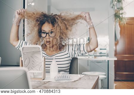 One Young Woman At Home Looking Bad Condition Of Her Hair Ready To Use And Apply Beauty Treatment Al