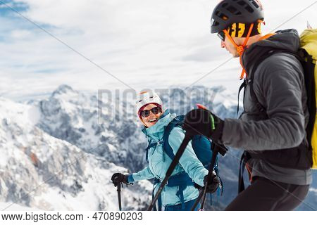 Waist Up Smiling Couple Of Mountaineers Ski Touring In The Snowy Alps
