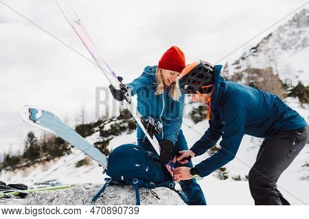 Couple Getting Ready For Ski Touring Adventure In The Alps