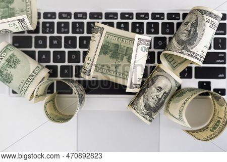 Us Hundred Dollar Bills On White Modern Computer Keyboard.