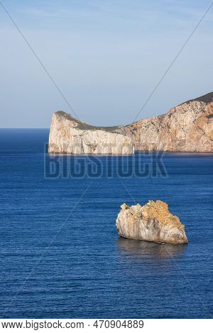 Rocky Cliffs On The Sea Coast. Sardinia, Italy. Nature Background