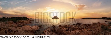 Rocky Beach On The Mediterranean Sea. Punta Don Diego, Sardinia, Italy. Dramatic Sunrise Sky Art Ren