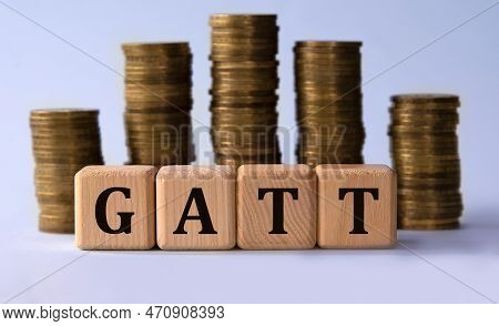 Gatt (general Agreement On Tariffs And Trade) - Acronym On Wooden Cubes On The Background Of Stacks 