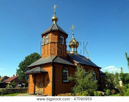 Picturesque Wooden Orthodox Church In The Village Kostomloty In Eastern Poland