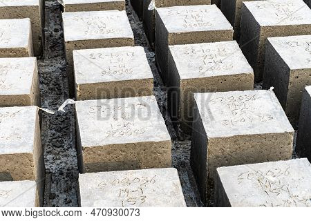 Concrete Cube Over Block Background. Rock Bolder. Four Square Cinder Blocks In A Row