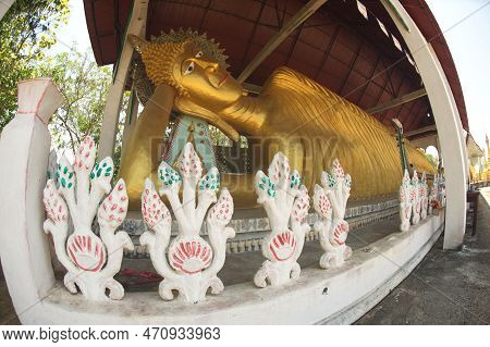 Kanchanaburi ,thailand - April 17, 2016 : A Large Golden Reclining Buddha Image At Wat Somdet In Amp