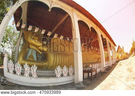 Kanchanaburi ,thailand - April 17, 2016 : A Large Golden Reclining Buddha Image At Wat Somdet In Amp
