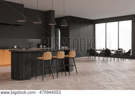 Corner View On Dark Kitchen Room Interior With Dining Table, Island, Barstools, Armchairs, Grey Wall