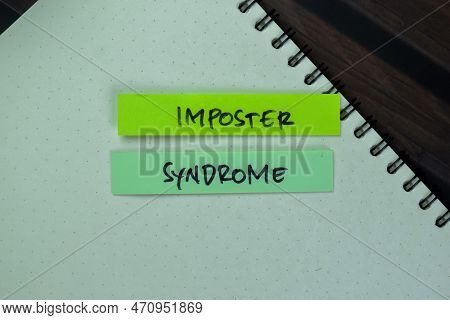 Concept Of Imposter Syndrome Write On Sticky Notes Isolated On Wooden Table.
