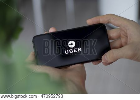 Irpen, Ukraine - January 20 20223, Closeup Of Smartphone Screen Uber Logo Lettering With In Mans Han