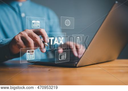 Businesman Using Computer To Complete Individual Income Tax Return Form Online For Tax Payment. Gove