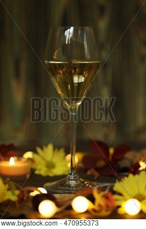 Glass Of White Wine With Autumn Decoration