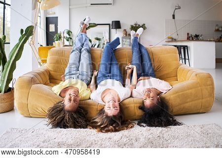 Three Mixed Race Multi Ethnic Female Best Friends Laugh Good Happy At Sofa Home. Cheerful Women Havi