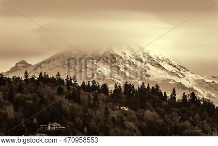 Clouds Cover Mount Rainier Across The Puget Soud In Washington State.