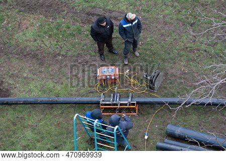 Tiraspol, Moldova - 13, February, 2023: Laying Sanitary Sewer Pipes. Preparation Of Plastic Pipes Fo