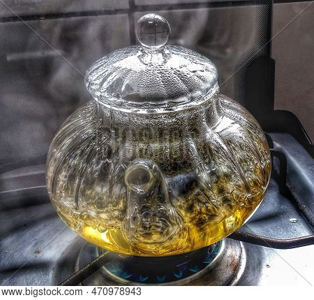 A Little Ketle With Water And Tea Boiling On The Stove