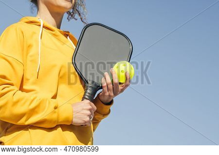 Woman Playing Pickleball Game, Hitting Pickleball Yellow Ball With Paddle, Outdoor Sport Leisure Act