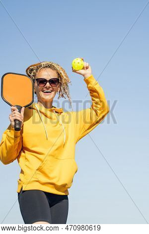 Woman Playing Pickleball Game, Hitting Pickleball Yellow Ball With Paddle, Outdoor Sport Leisure Act