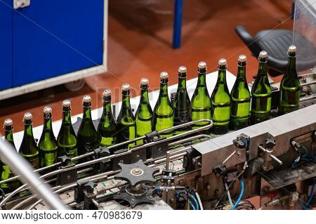 Production Of Cremant Sparkling Wine In Burgundy, France. Automatically Powered Bottling And Corking