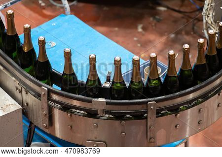 Production Of Cremant Sparkling Wine In Burgundy, France. Automatically Powered Bottling And Corking