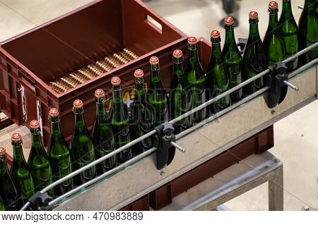 Production Of Cremant Sparkling Wine In Burgundy, France. Automatically Powered Bottling And Corking