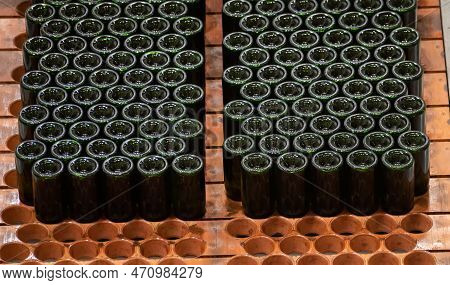 Production Of Cremant Sparkling Wine In Burgundy, France. Automatically Powered Bottling And Riddlin