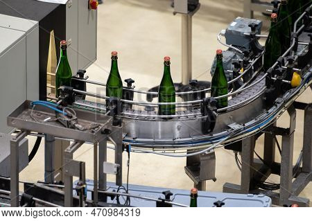 Production Of Cremant Sparkling Wine In Burgundy, France. Automatically Powered Bottling And Corking