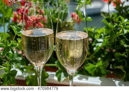 Drinking Of French Brut Champagne Sparkling Wine In Glasses In Yacht Harbour Of Port Grimaud Near Sa