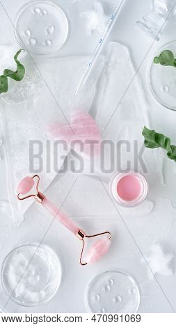 Pink Quarz Massage Roller, Moisturizer In Glass Petri Dish, Various Glass Objects, Stones And Exotic