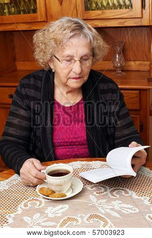 Senior With Tea Reading