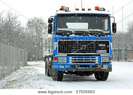 Blue Volvo F16 Truck In Snowfall