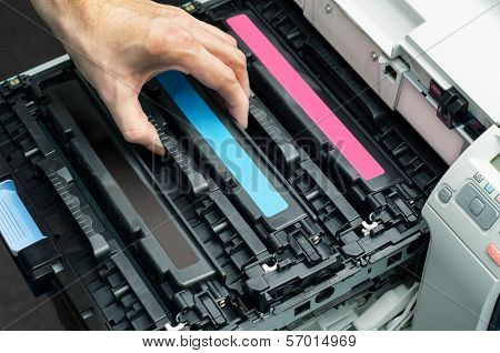 Man Puts Toner In The Printer