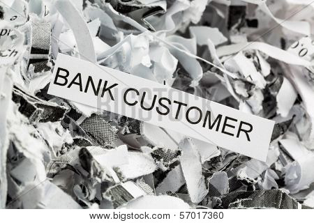 shredded paper tagged with bank customer, symbol photo for data destruction, customer data and banking secrecy