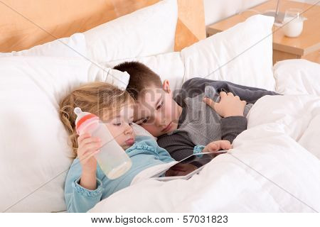 Tired Little Brother And Sister Going To Sleep