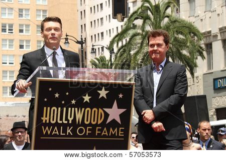 Ryan Seacrest and Simon Fuller at Simon Fuller's induction into the Hollywood Walk of Fame, Hollywood, CA. 05-23-11