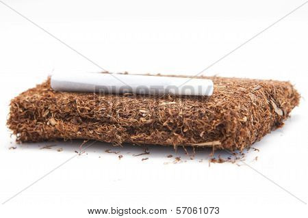 A pack of rolling tobacco with rolled cigarette