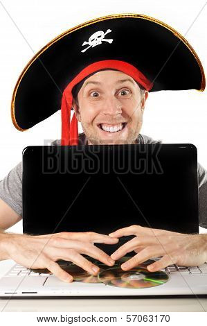 Young Man In Pirate Costume And Computer