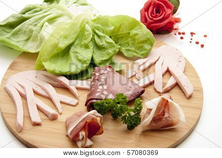 Fresh Raw and Cooked Ham with Cold Cuts from Blood Sausage