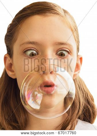 A Girl Inflates Soap Bubble