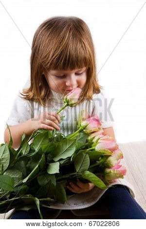 Beautiful Little Girl With Roses Flowers