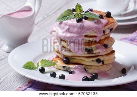 Pancake With Blueberries, Mint And Sauce Poured On Top