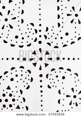 Punched Paisley Ornament On White Leather