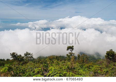 Fog And Clouds Over Mountain. Volcano Mount Merapi.