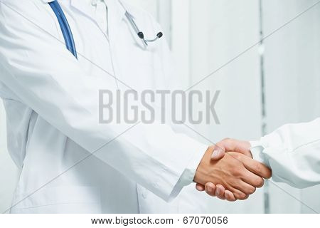 Doctor Shakes Hand With Another Doctor, Teamwork