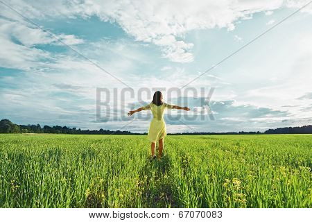 Woman In A Green Field