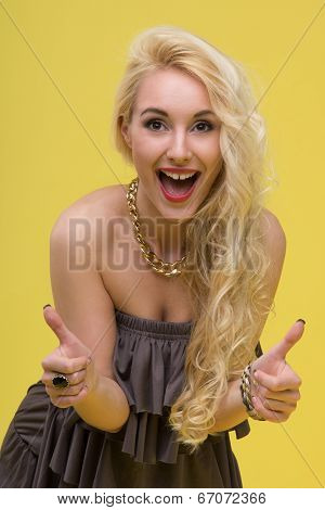 Woman standing on yellow background