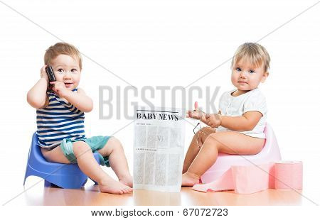Funny Children With Newspaper And Pda On Chamberpot