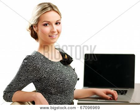 young woman with a laptop sitting isolated on white background