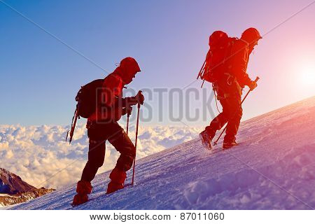 climbers at the top of a pass