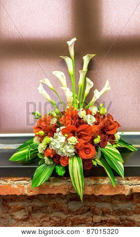 Bouquet Of Red Amarillis On A Window Sill